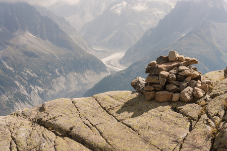 stony cairn above valley in Haute-Savoie, France の写真素材