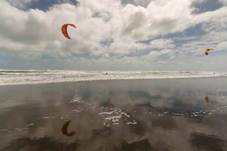 kitesurfers on Muriwai beachの写真素材