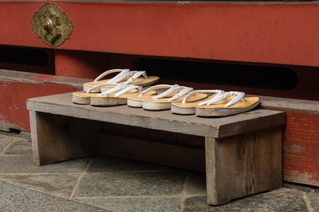 geta sandals left outside Buddhist shrineの写真素材