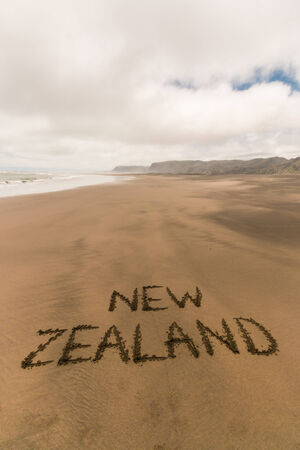 handwriting in sand on New Zealand coastの写真素材