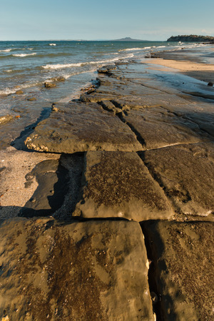 lava plates on New Zealand coastの写真素材