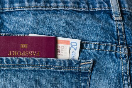 passport and Euro banknotes in jeans pocketの写真素材