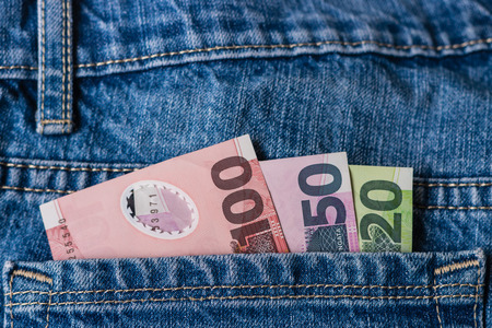 New Zealand dollars in jeans pocketの写真素材