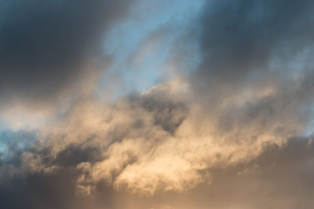 cumulus clouds at sunset