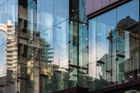 buildings reflecting in office windowsの写真素材