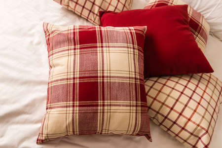 tartan pillows on bedの写真素材