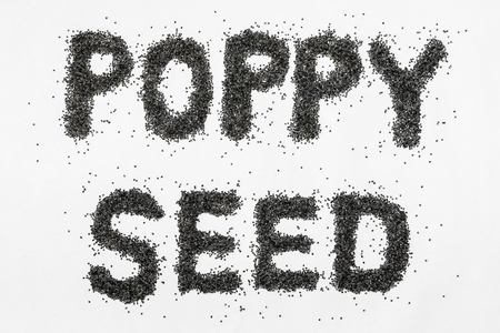 isolated poppy seeds letters on white backgroundの写真素材