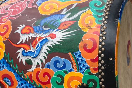 closeup of dragon painted on traditional Korean drumの写真素材