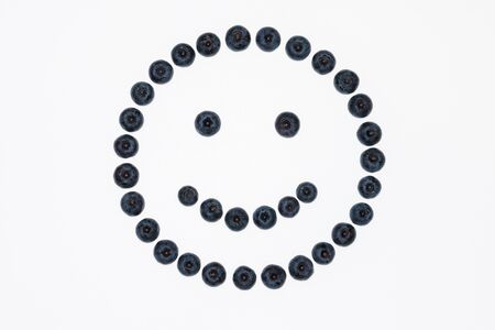 closeup of isolated blueberry face on white backgroundの写真素材