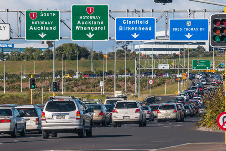 rush hour traffic jam on Auckland motorway with cars waiting in long queue