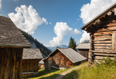 old wooden houses in Swiss Alps with blue sky and copy space