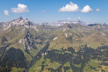 aerial view of mountain range in Glarus Alps in Switzerland with blue sky and copy spaceの写真素材