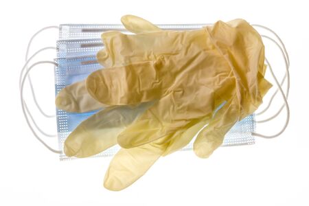 yellow latex surgical gloves with surgical face maskの写真素材
