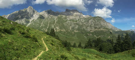 hiking track leading to the Ruchigrat mountain ridge in Swiss Alps, Glarus Canton, Switzerlandの写真素材