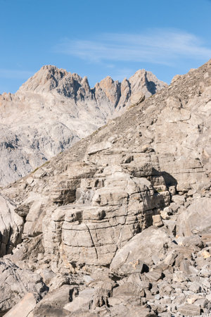 limestone formation with mountain range in distance in Picos de Europa National Park, Northern Spainの写真素材