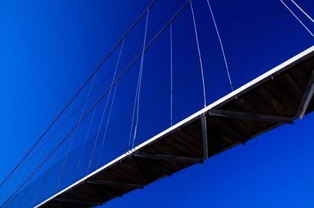 Suspension bridge and blue sky without cloudsの写真素材