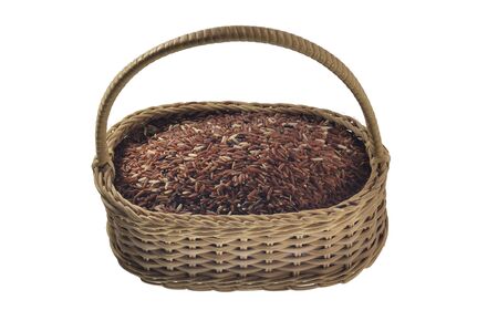 brown rice in the bamboo basket ,isolated on white backgroundの写真素材