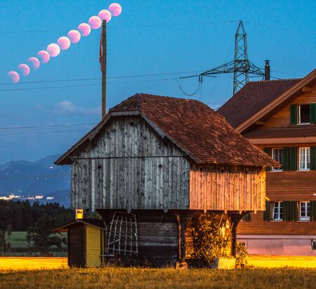 lunar eclipse trail red moon breathtaking scenery in rural place lucerne switzerlandの写真素材