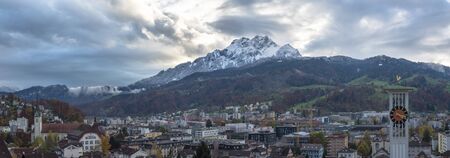 panoramic view to maount pilatus massif sneaking clounds over lopper switzerlandの写真素材
