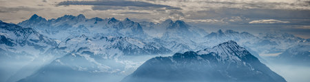 wonderful panoramic view from rigi into swiss snowy alps switzerland