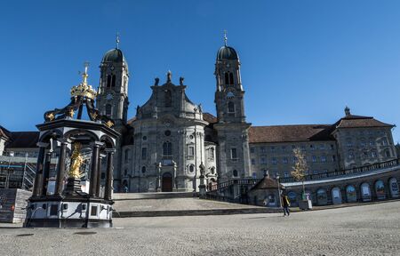 blue sky winter Einsiedeln Abbey Benedictine monastery in canton Schwyz Switzerlandの写真素材