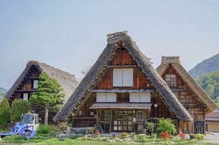 House under sky with green grass in shirakawagoのeditorial素材