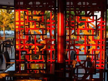Wooden decorative lattice on a verandah of  Mexican restaurant shined with the morning sunの写真素材