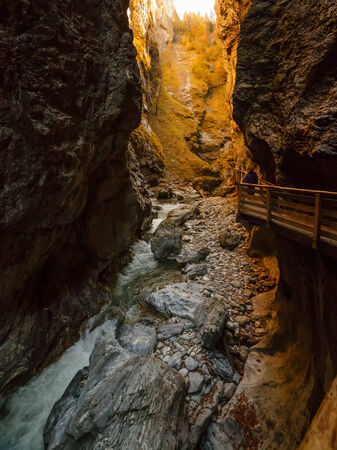 Mountain river flowing through the narrow rocky gorgeの写真素材