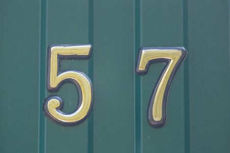 House number on a fence in the villageの写真素材