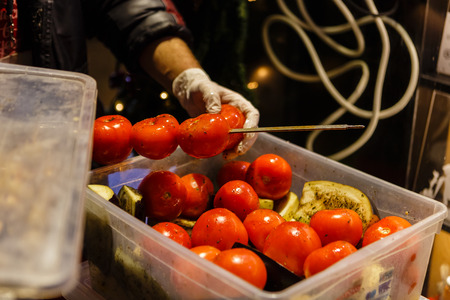 Cooking on the street for the people walking on a holidayの写真素材