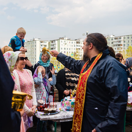 Moscow, Russia - April 27, 2019: Believing Muscovites consecrate in church Easter eggs and Easter...