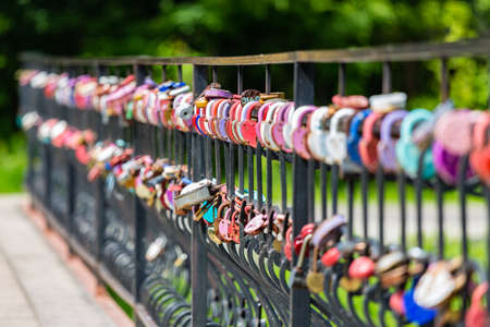 traditional wedding locks on the fence of the bridgeof the bridgeの写真素材