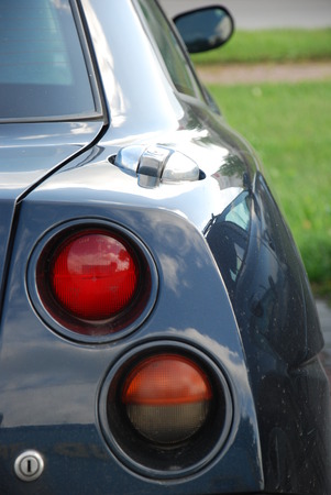 Navy blue sports car back partの写真素材
