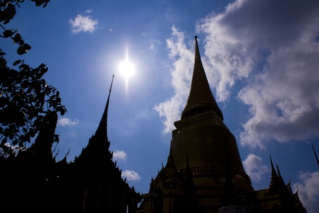 Temple inside the Bangkok Grand Palace against a blue skyの写真素材