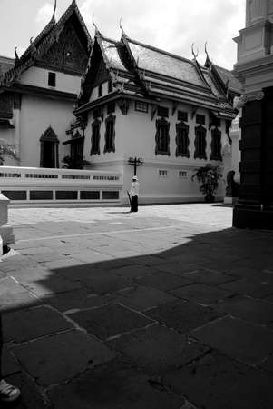A Royal Palace Guard standing guard under the heat of sun at the Bangkok Grand Palaceの写真素材
