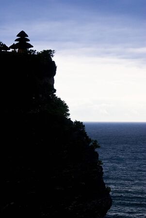 Pura Luhur Uluwatu on top of a clift overlooking Bali Straitの写真素材