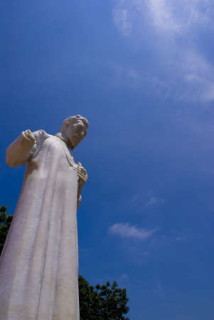 Statue of Saint Fraicis Xavier against a blue skyの写真素材