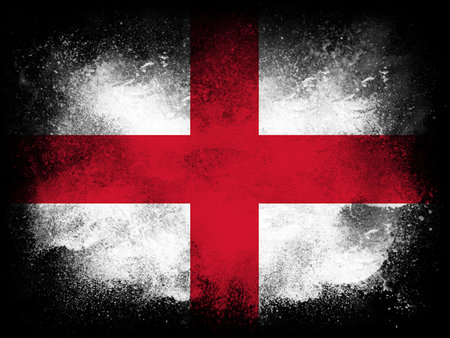 Powder paint exploding in colors of the Republic of England flag isolated on black background. Abstract particles explosion of colorful dust.の写真素材