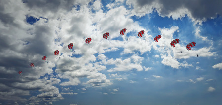 Man paragliding in the sky captured in different phases. Extreme sport.の写真素材