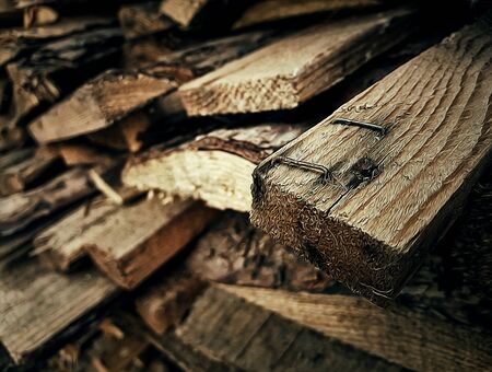 Closeup illustration of a stack of logs, old firewoodの写真素材