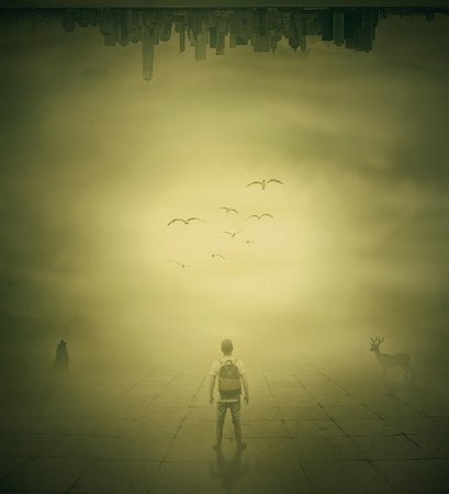Surrealistic image with a man standing in a foggy street below a city buidings choosing the correct wayの写真素材