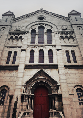 Side door and facade of Sacre Coeur Cathedral on Montmartre , Paris, France.の写真素材