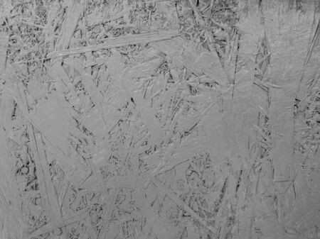 Abstract grey color painted oriented strand board. Grunge plywood texture background.の写真素材