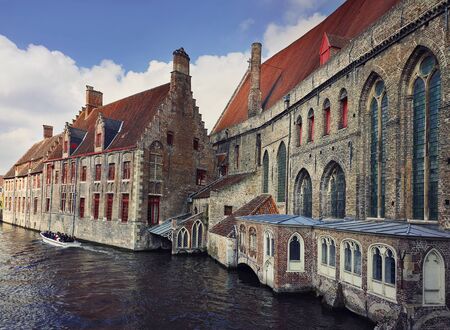 Architecture outdoors of Sint-Jans hospital, the old city buildings on the water canals in Bruges, Belgium.の写真素材