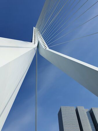 Erasmus bridge over Meuse river in Rotterdam, the Netherlands. Abstract architecture details over blue sky background. Erasmusbrug called the swan, 284m long, designed by Ben van Berkel.の写真素材