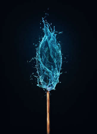 Different thinking concept as an unusual matchstick burning in a water flame. Blue liquid splash drops on a match, instead of fire. Surreal and unique symbol for eco energy and environmental issueの写真素材