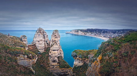 Beautiful panoramic view to the Etretat village and beach resort from the famous Falaise d'Aval cliffs in Normandy, Franceの写真素材