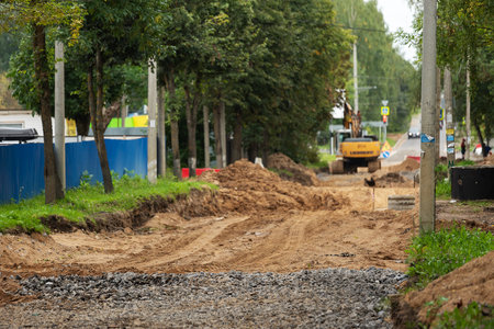 poorly executed road repairs. replacing the old curb stone with a new one. road workingの写真素材