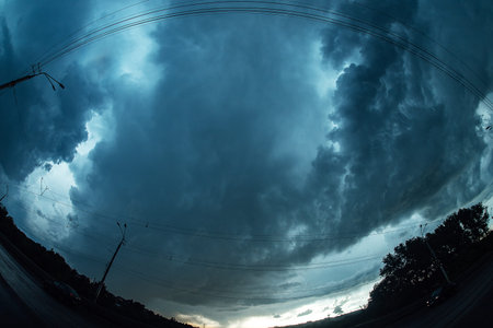 View of the road from the car on a stormy day.