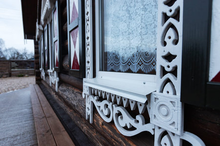 Beautiful wooden window with decorative elements on the terrace of the house